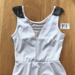 White mini peplum dress with shoulder beading